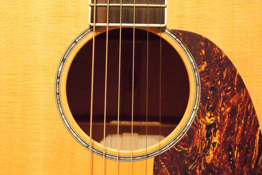 Acoustic guitars close-up of a spruce top and soundhole